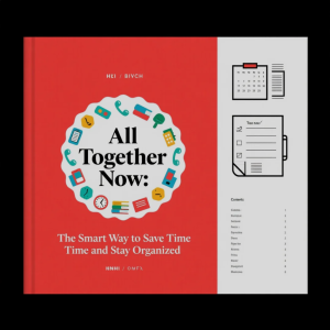 Desk with organized planner, laptop, and tools for productivity